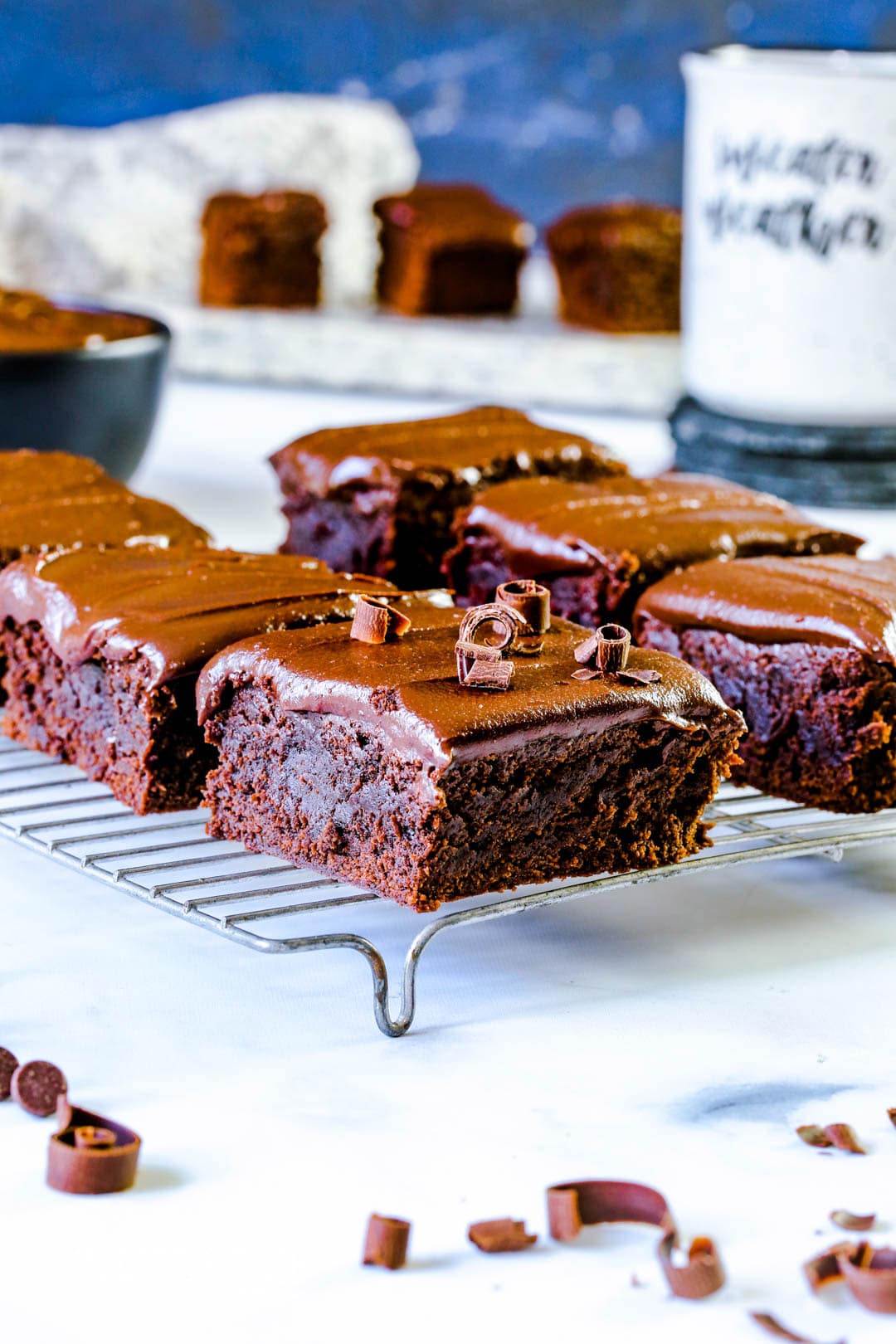 six chocolate fudge brownies on a cooling rack 