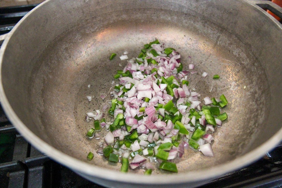 onions and peppers in a large skillet