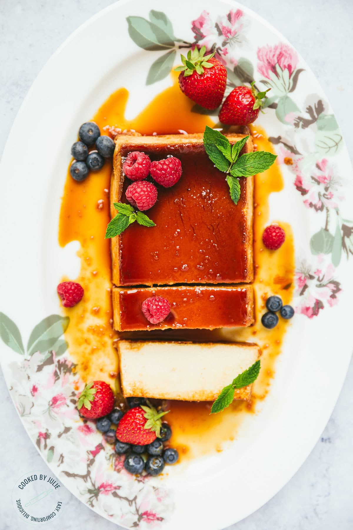 flan with berries and mint, sliced into.