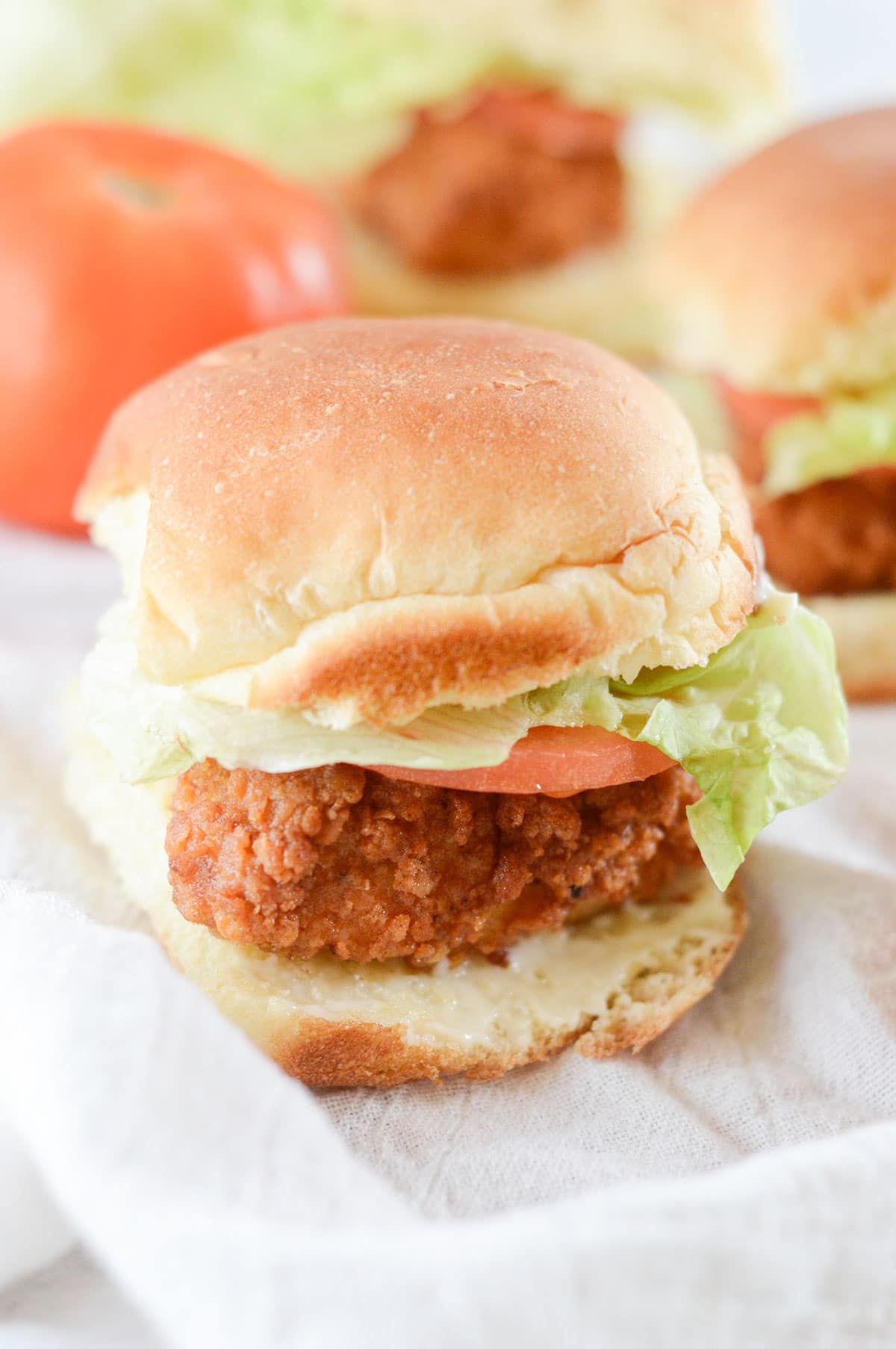 crispy chicken slider on a white surface 