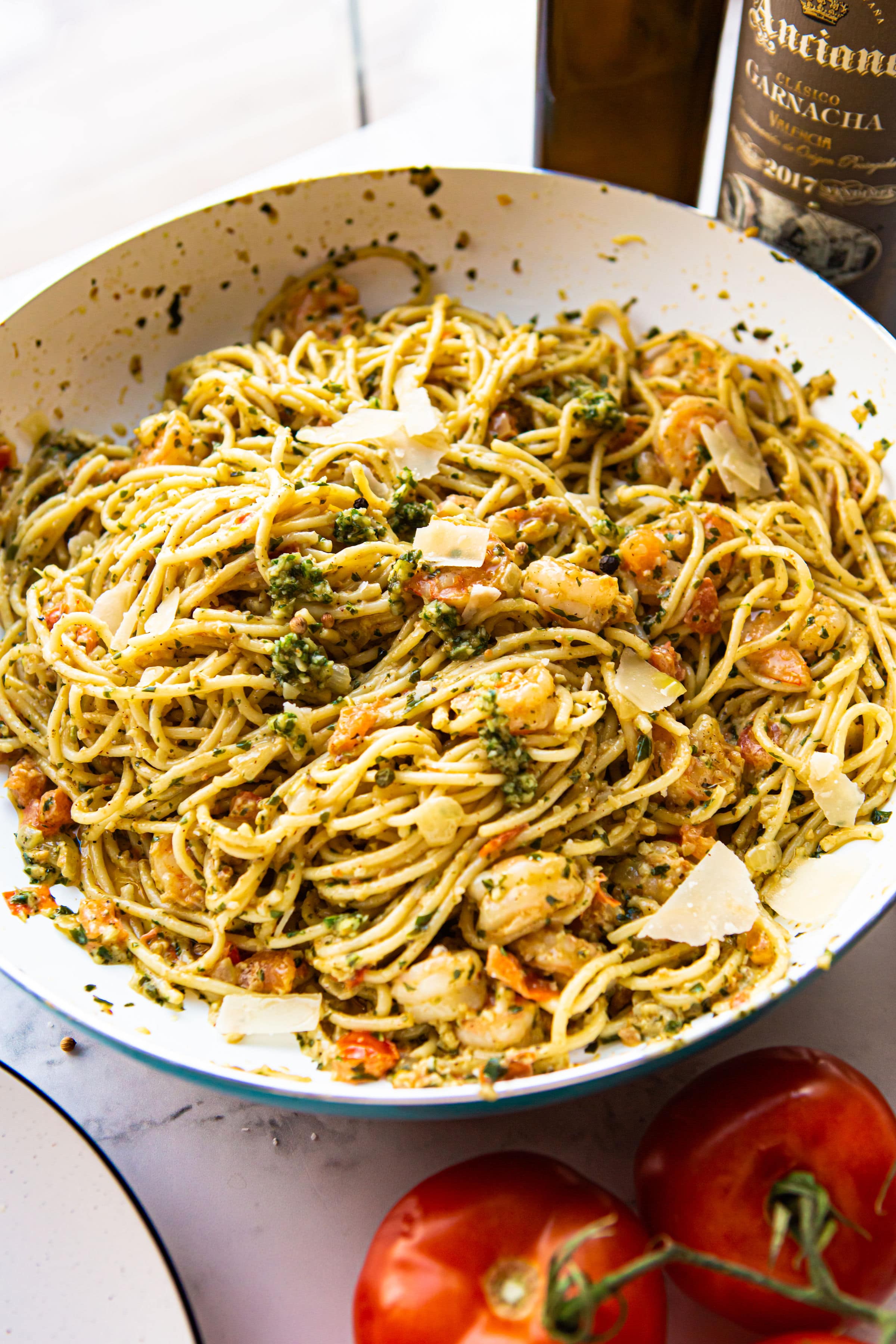 shrimp pesto pasta in a skillet.