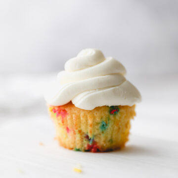 one funfetti cupcake with vanilla buttercream.