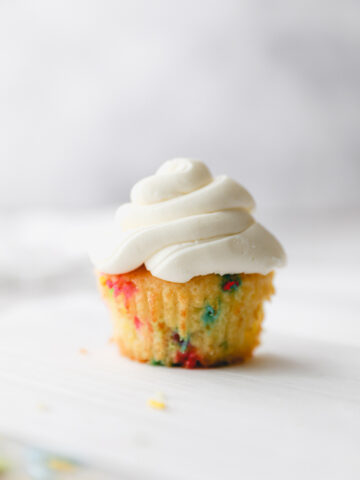 one funfetti cupcake with vanilla buttercream.
