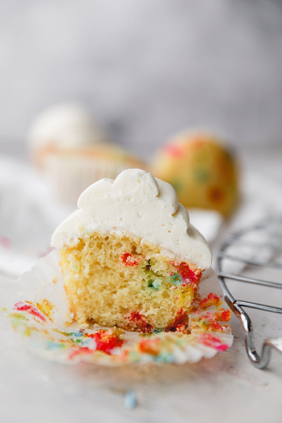 funfetti cupcake sliced in half up close. 