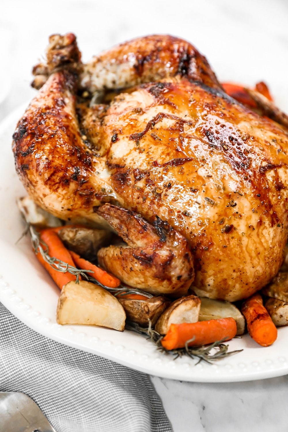 honey roasted chicken with potatoes and carrots up close. 