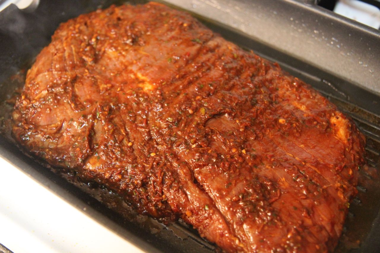 Marinate the flank steak with the pepper sauce for juicy, flavorful steak
