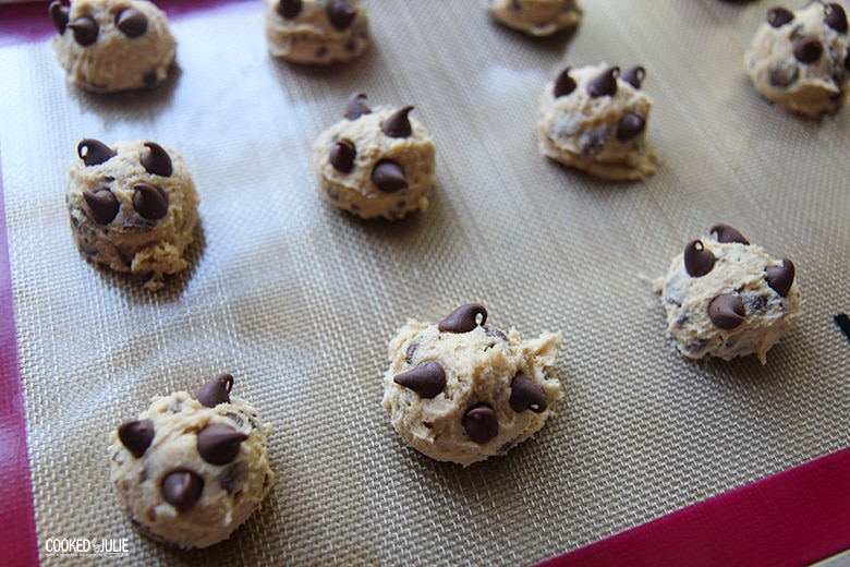 cookie dough balls on a baking sheet