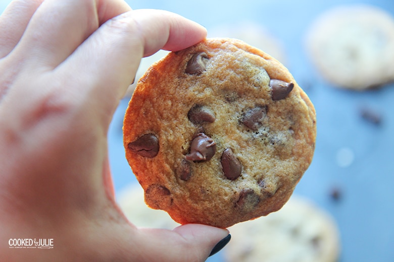 hand holding a chocolate chip cookie