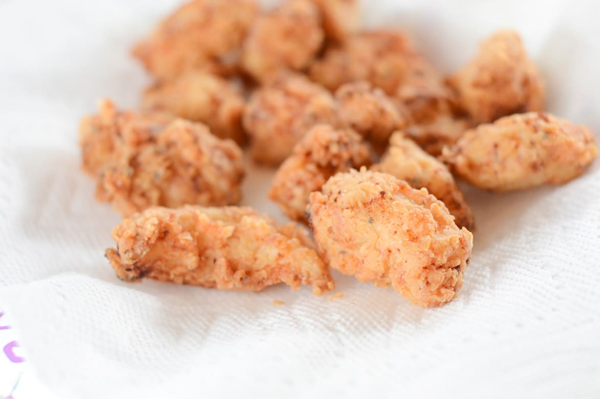 small pieces of fried chicken on paper towel 