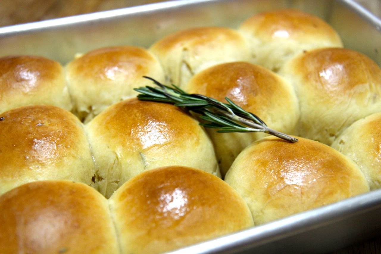 Rosemary garlic rolls topped with butter and baked to a golden brown perfection