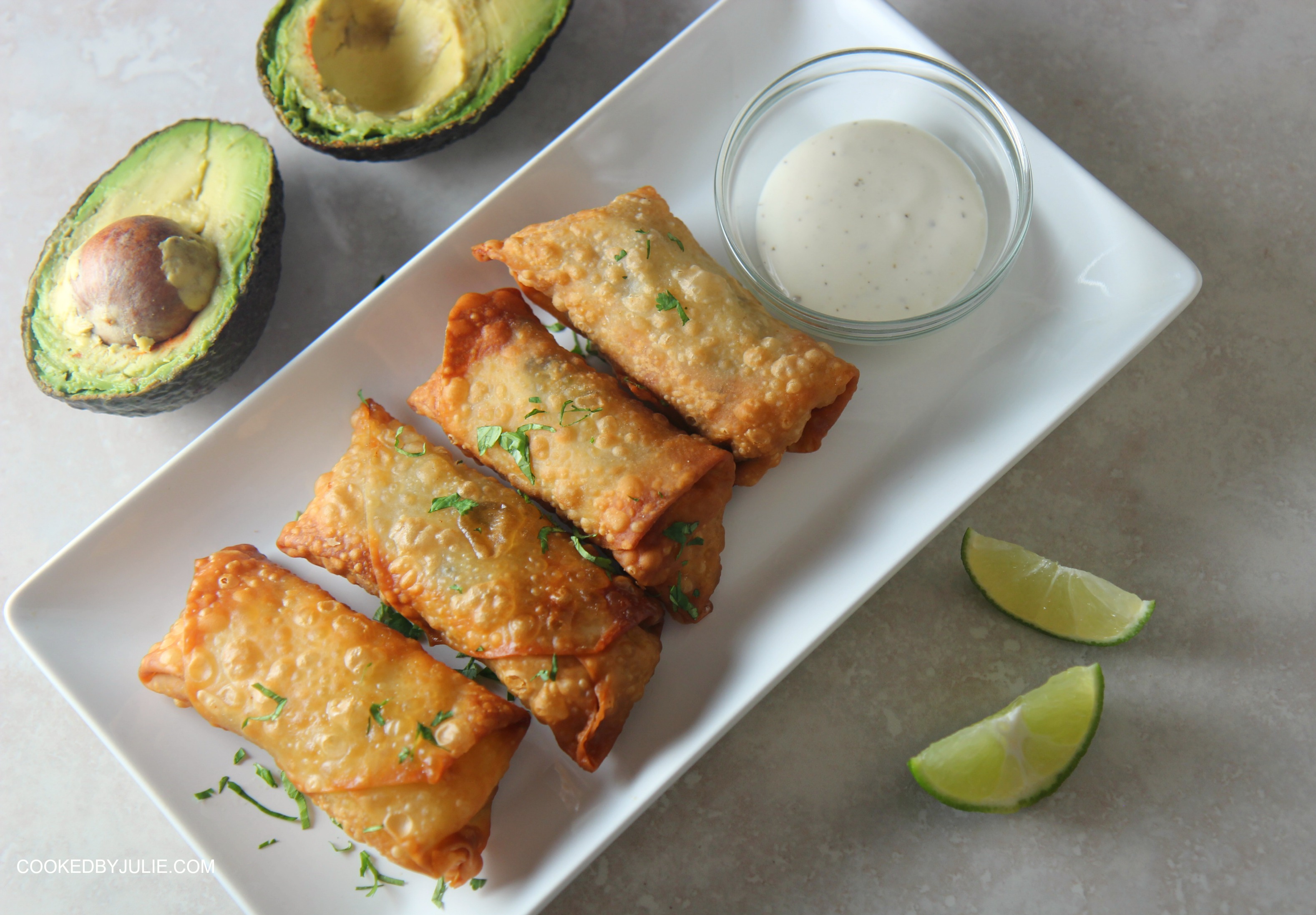 Serve these chicken avocado egg rolls with some ranch dipping sauce and lime wedges. 
