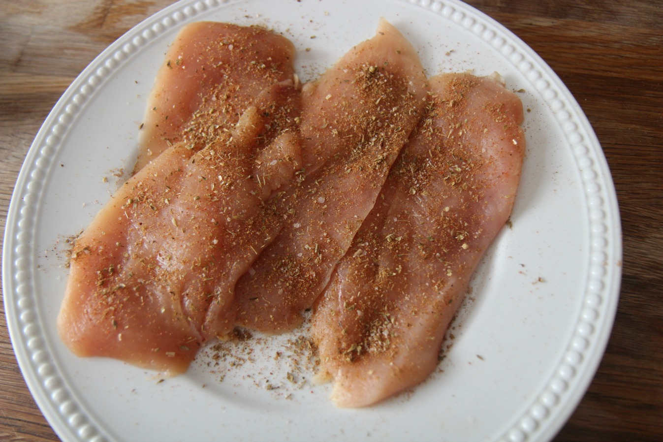 Step one is to season the chicken breasts before cooking. 