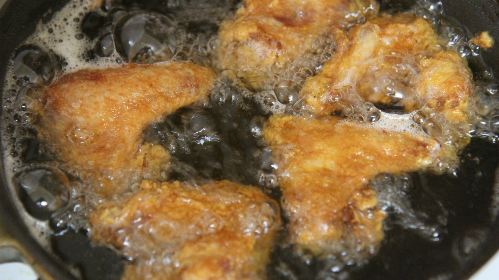 Make sure you pat the chicken wings dry before deep frying to prevent splatter.