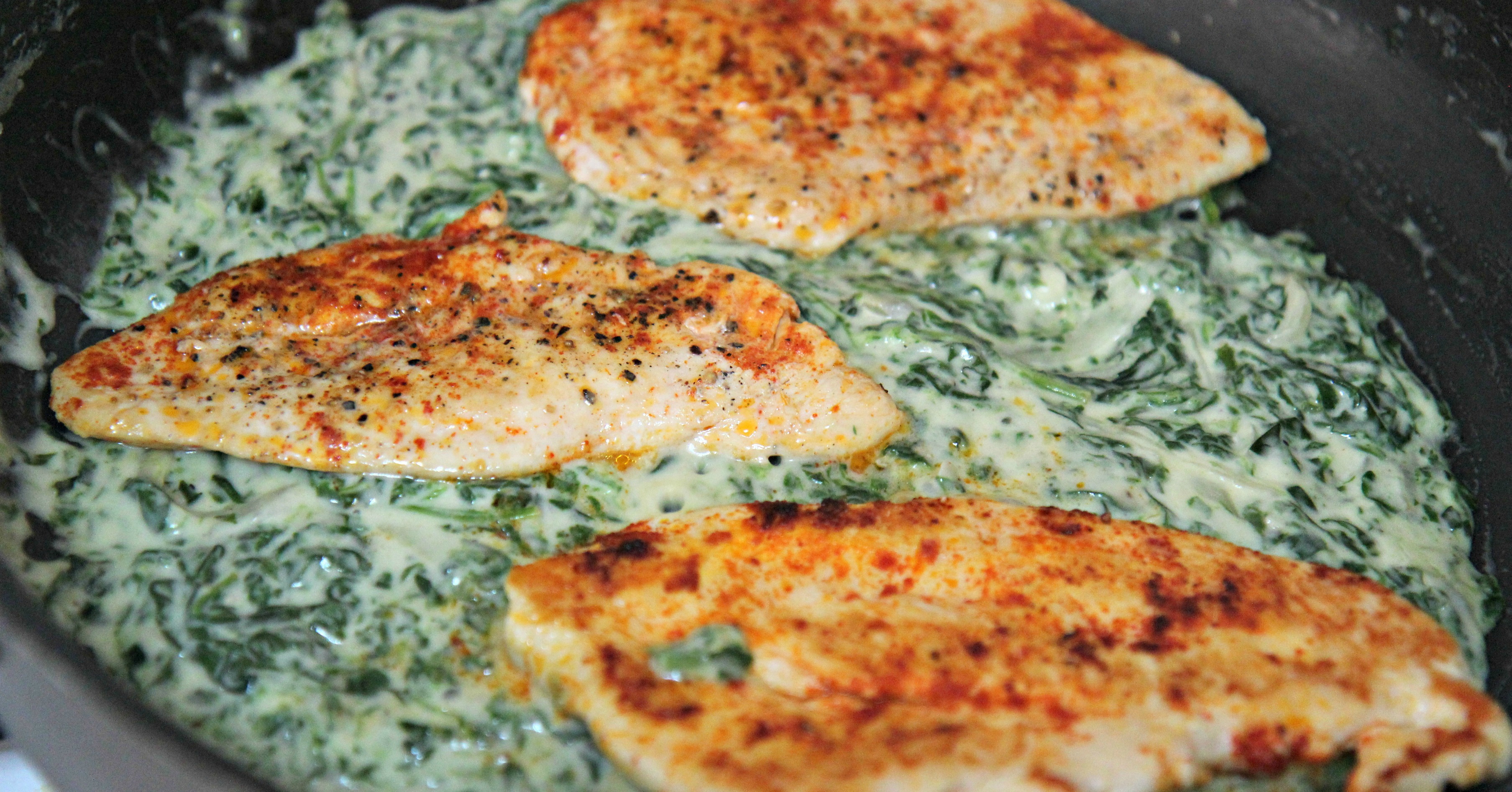 Perfectly seasoned chicken breast cooked in a creamy spinach sauce