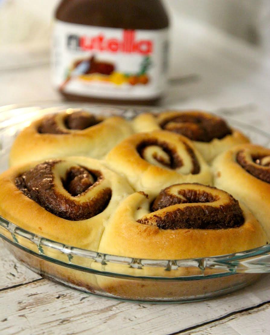 These homemade cinnamon rolls are filled with Nutella and baked to a golden brown perfection