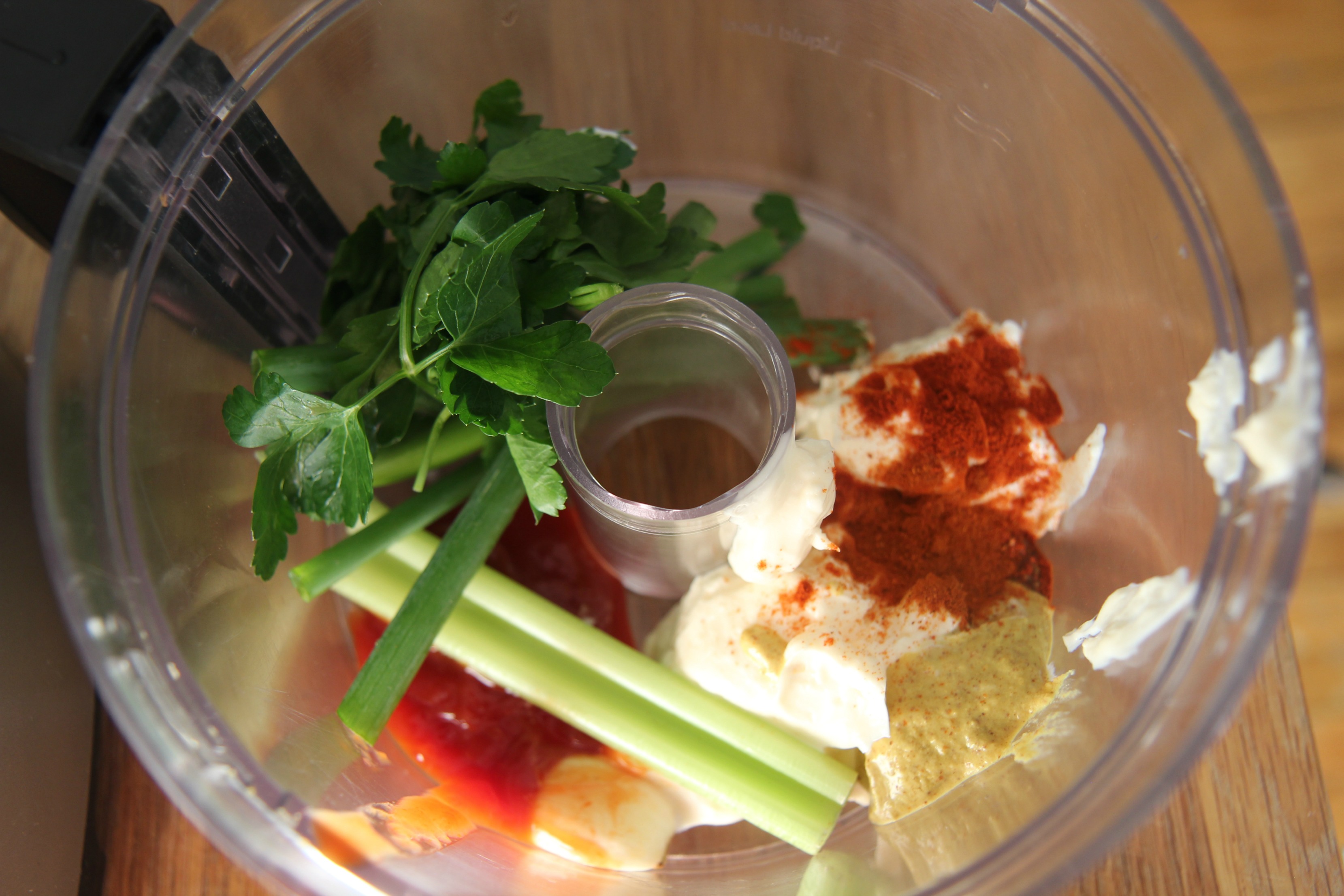 celery, mayo, spices, and fresh herbs in a food processor. 
