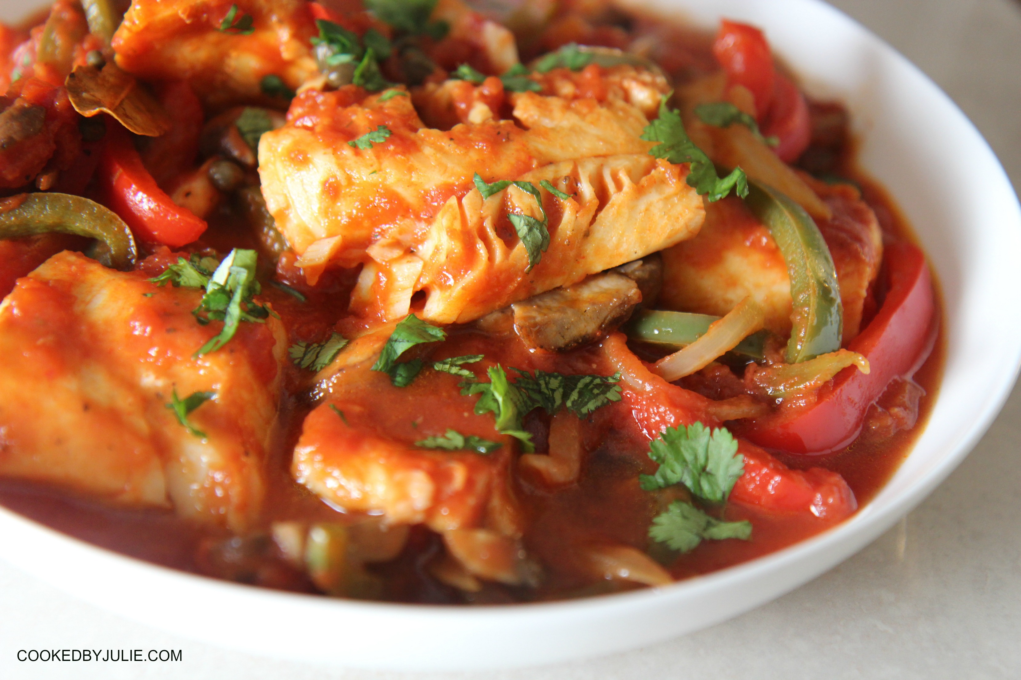 This delicious skillet cod recipe is ready in 20 minutes and is packed with juicy tomatoes, onions, peppers, and mushrooms! It's a fast and easy dinner solution. 