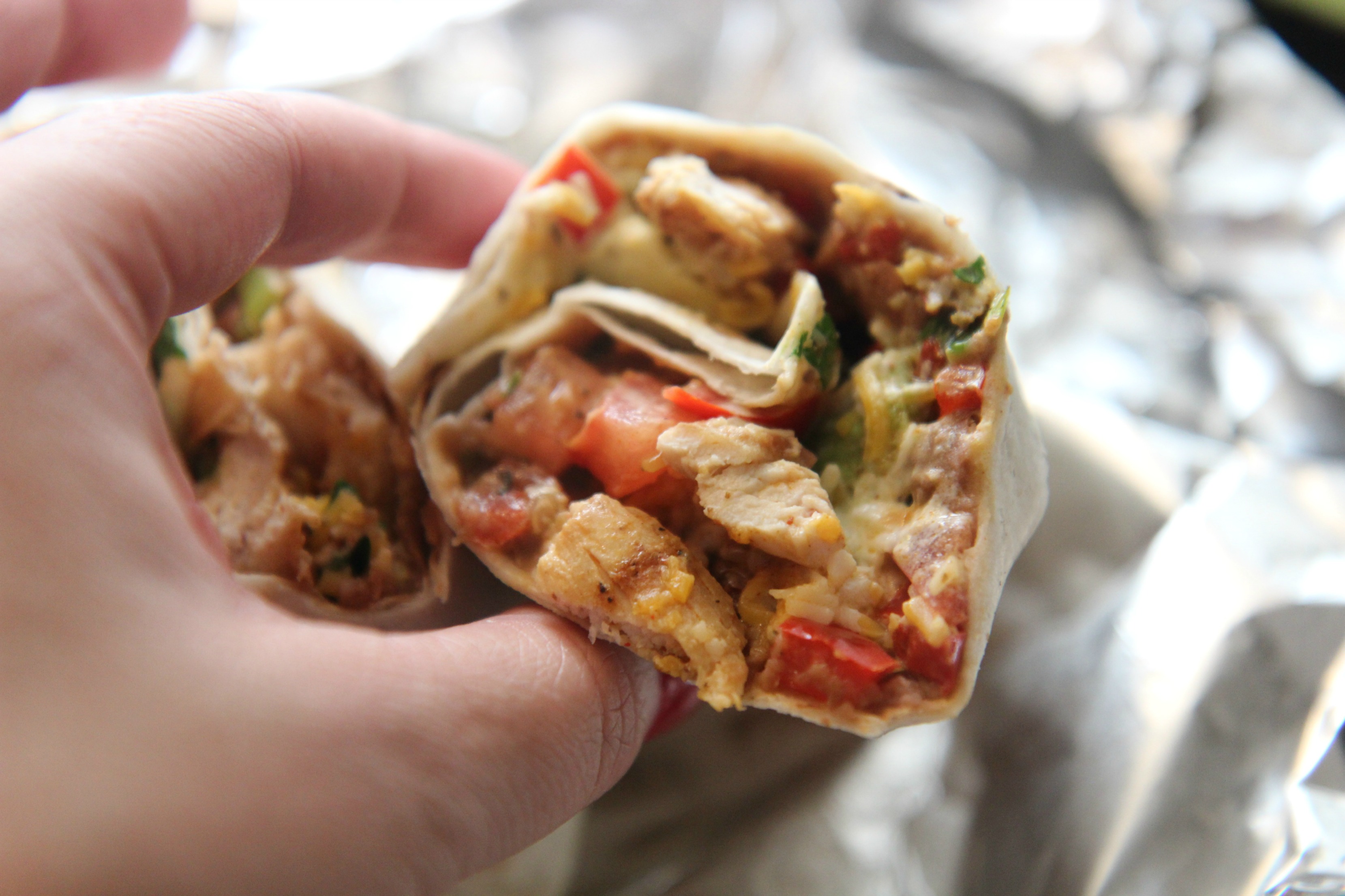 Served with sour cream and hot sauce, this Tex-Mex burrito is the perfect lunch.