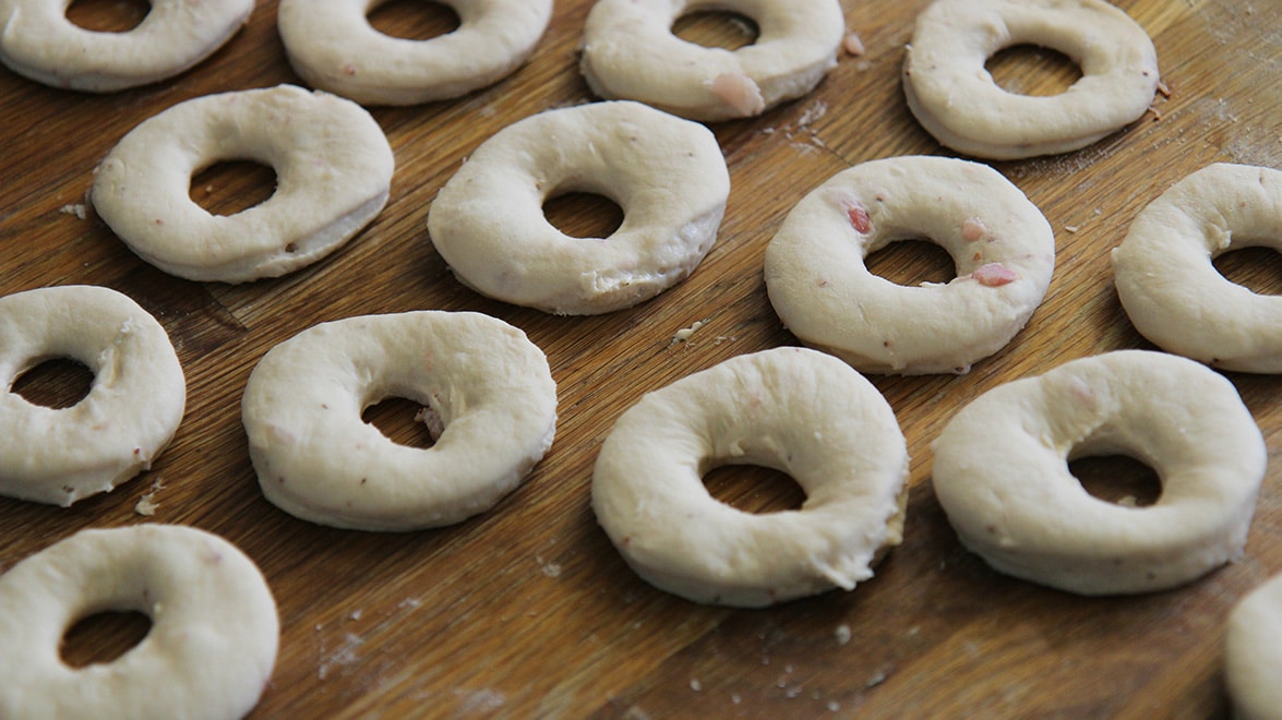 donut cut outs on a wooden surface.