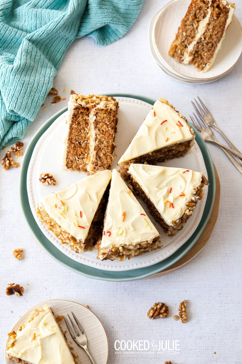 seven slices of carrot cake with three forks 