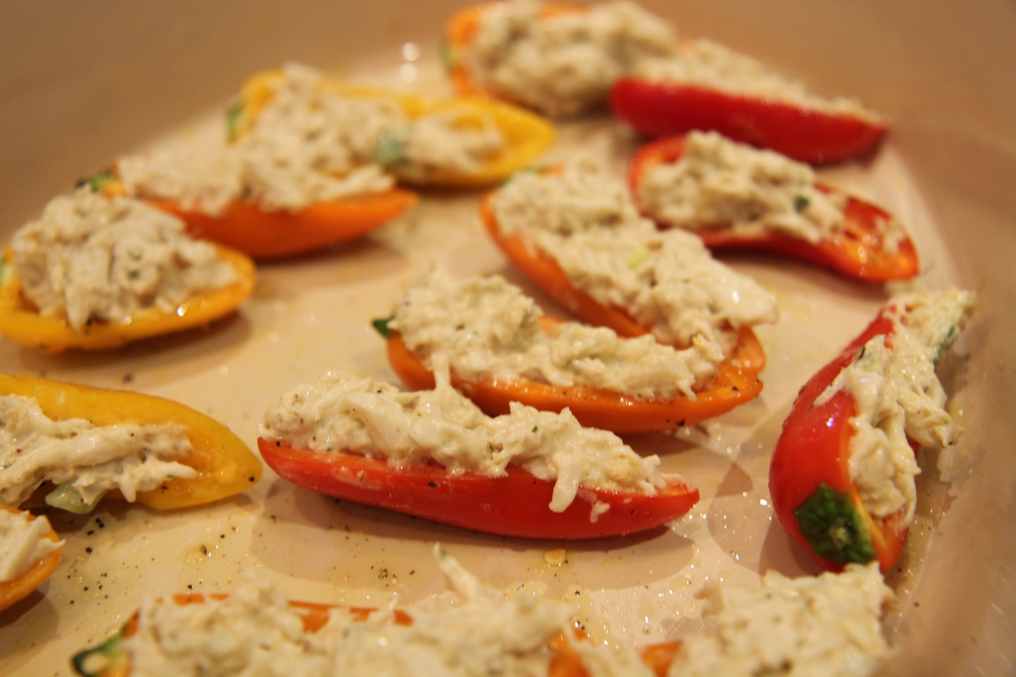 Drizzle the peppers with a little oil after filling them.