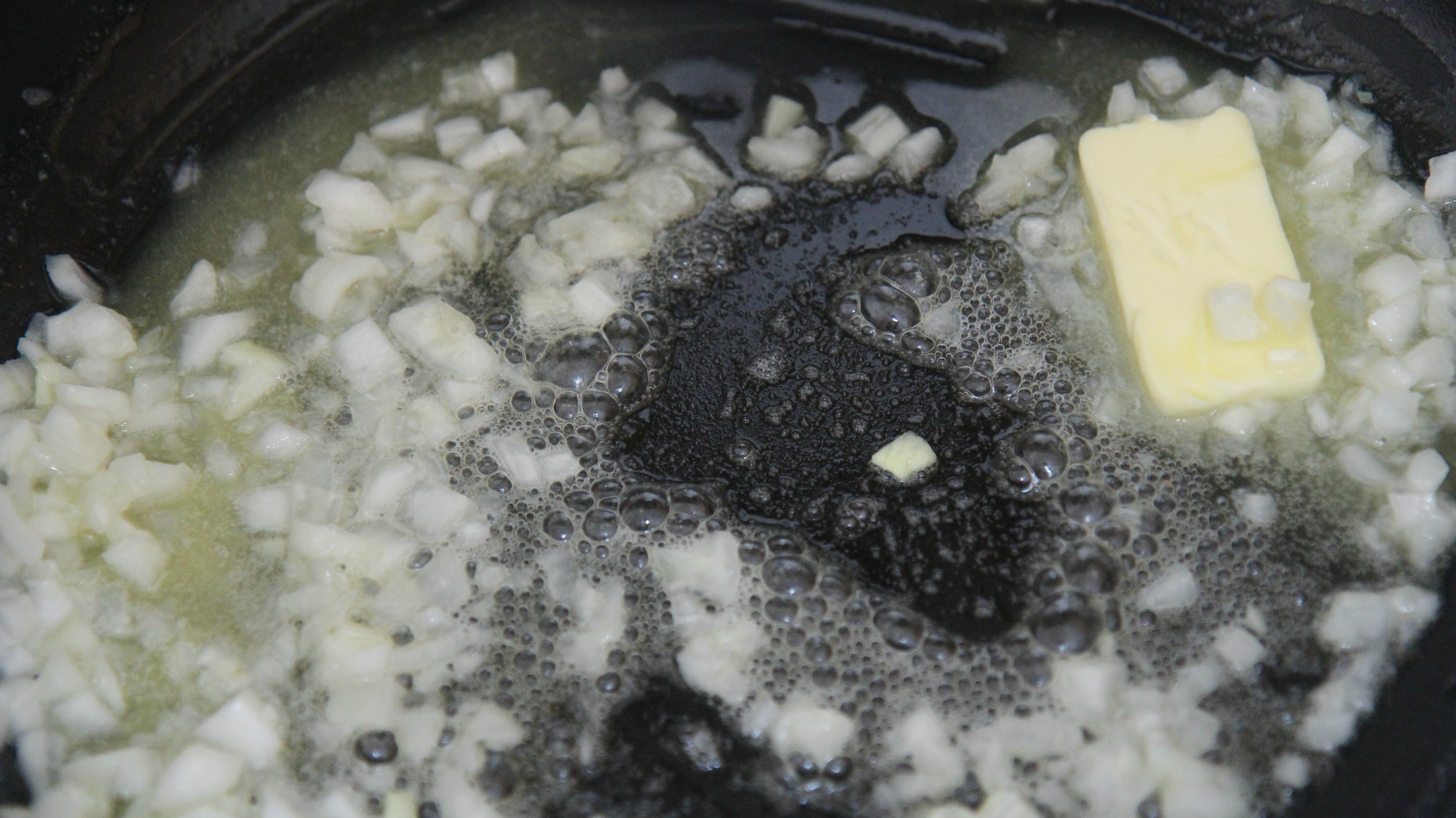 Saute chopped onions and garlic in butter.