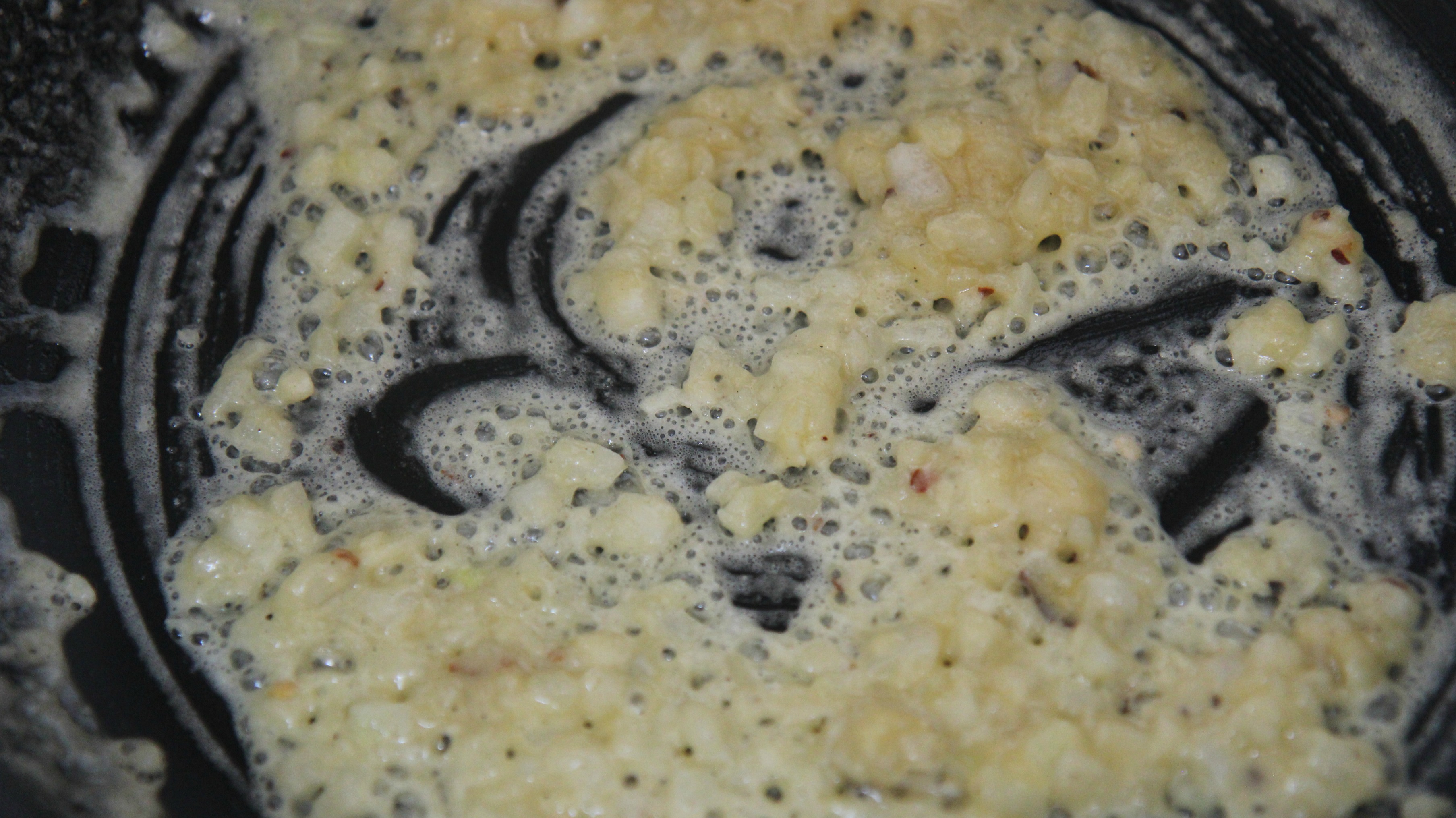 Saute onions and garlic in butter until the butter darkens to a slight brown, then you're ready to add the spinach.