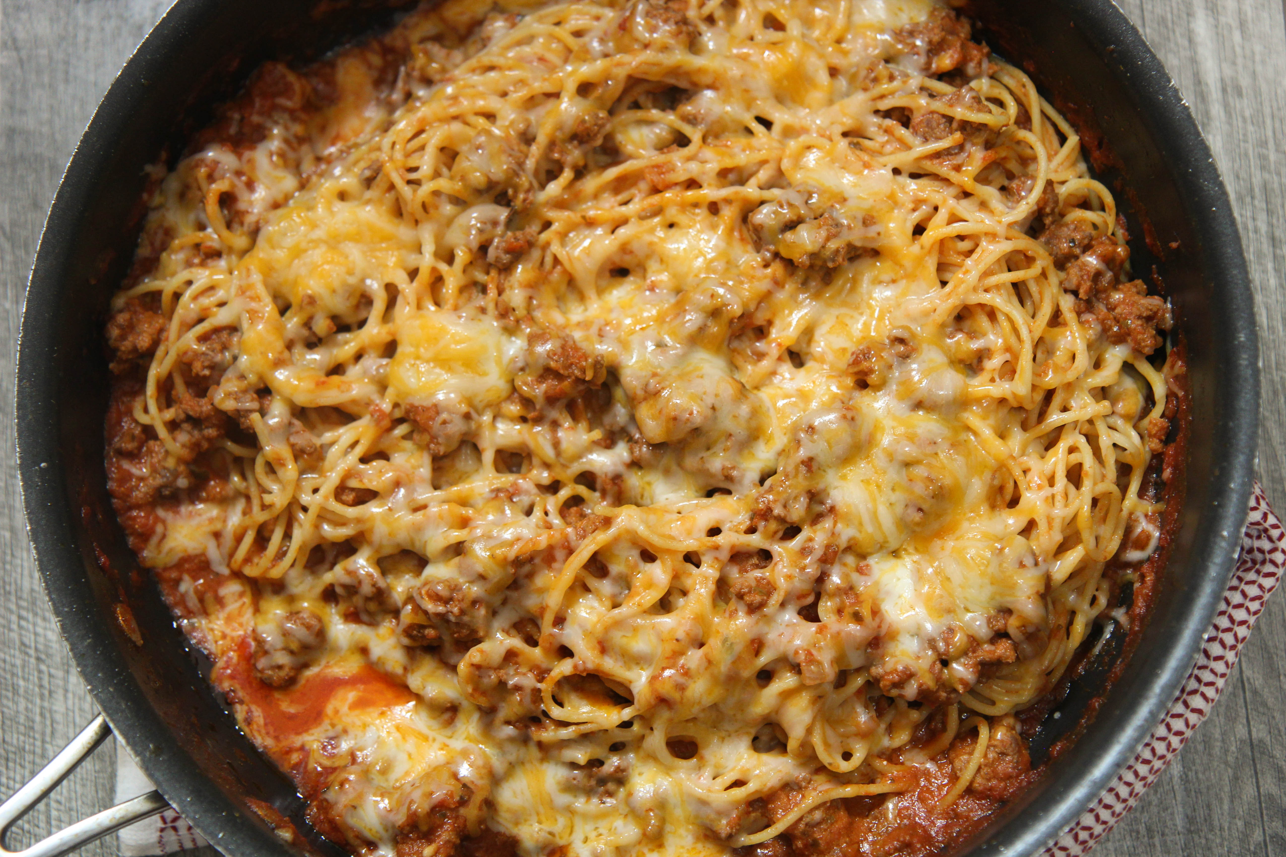 Cooked By Julie's taco spaghetti made with Barillo sauce and pasta is the perfect dish for a family dinner or cold winter night!