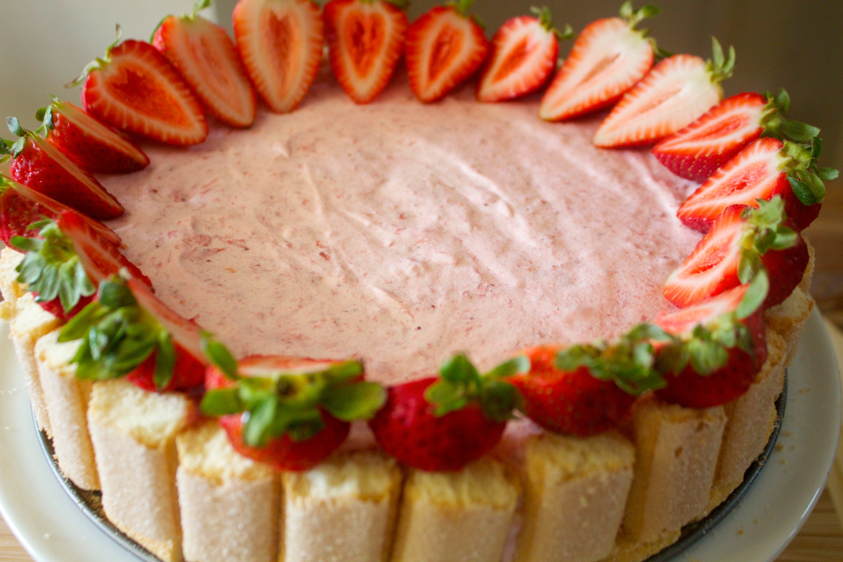 Lady fingers and fresh strawberries make this cake a star.