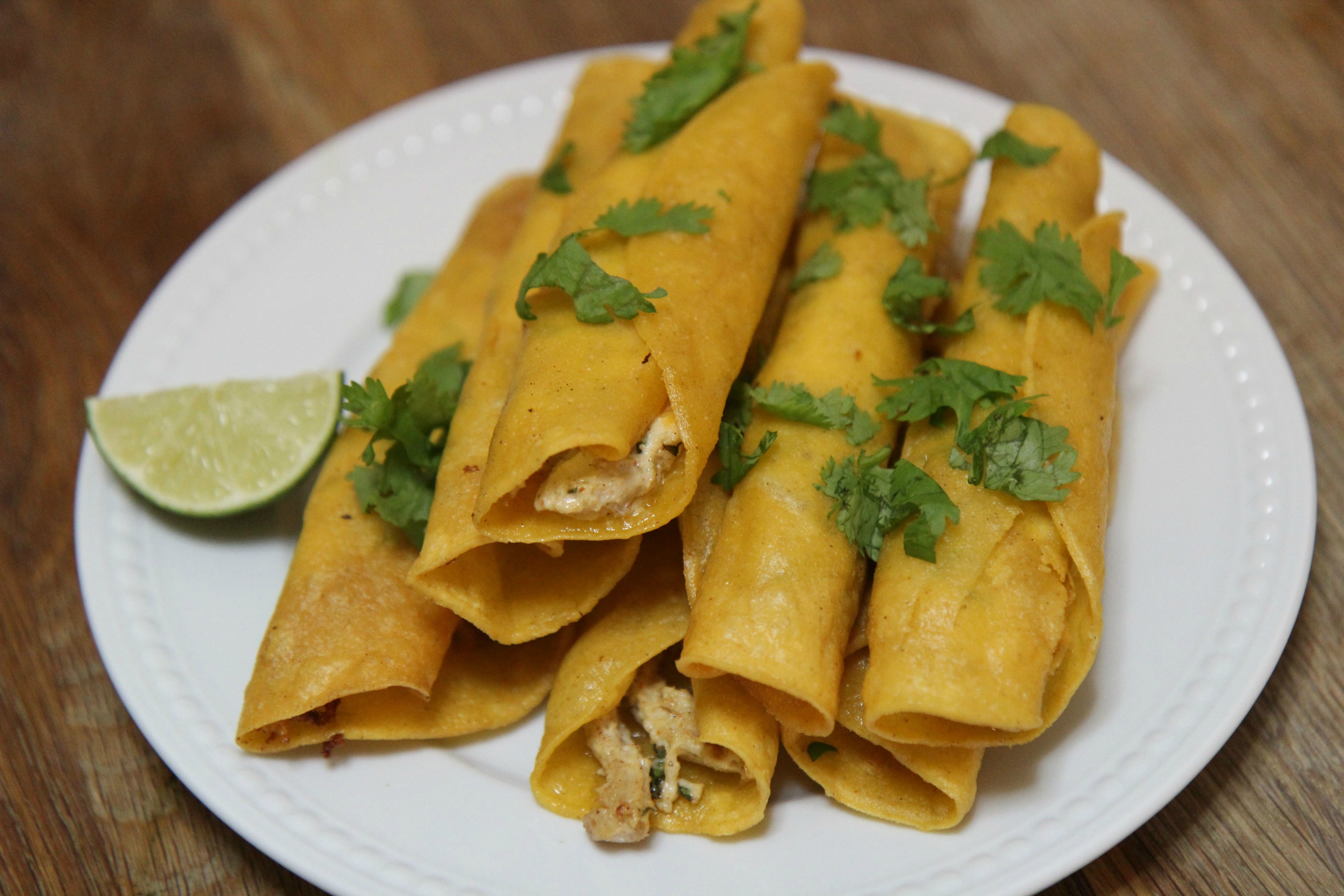Seasoned chicken and cream cheese rolled inside corn tortillas and fried to crispy perfection