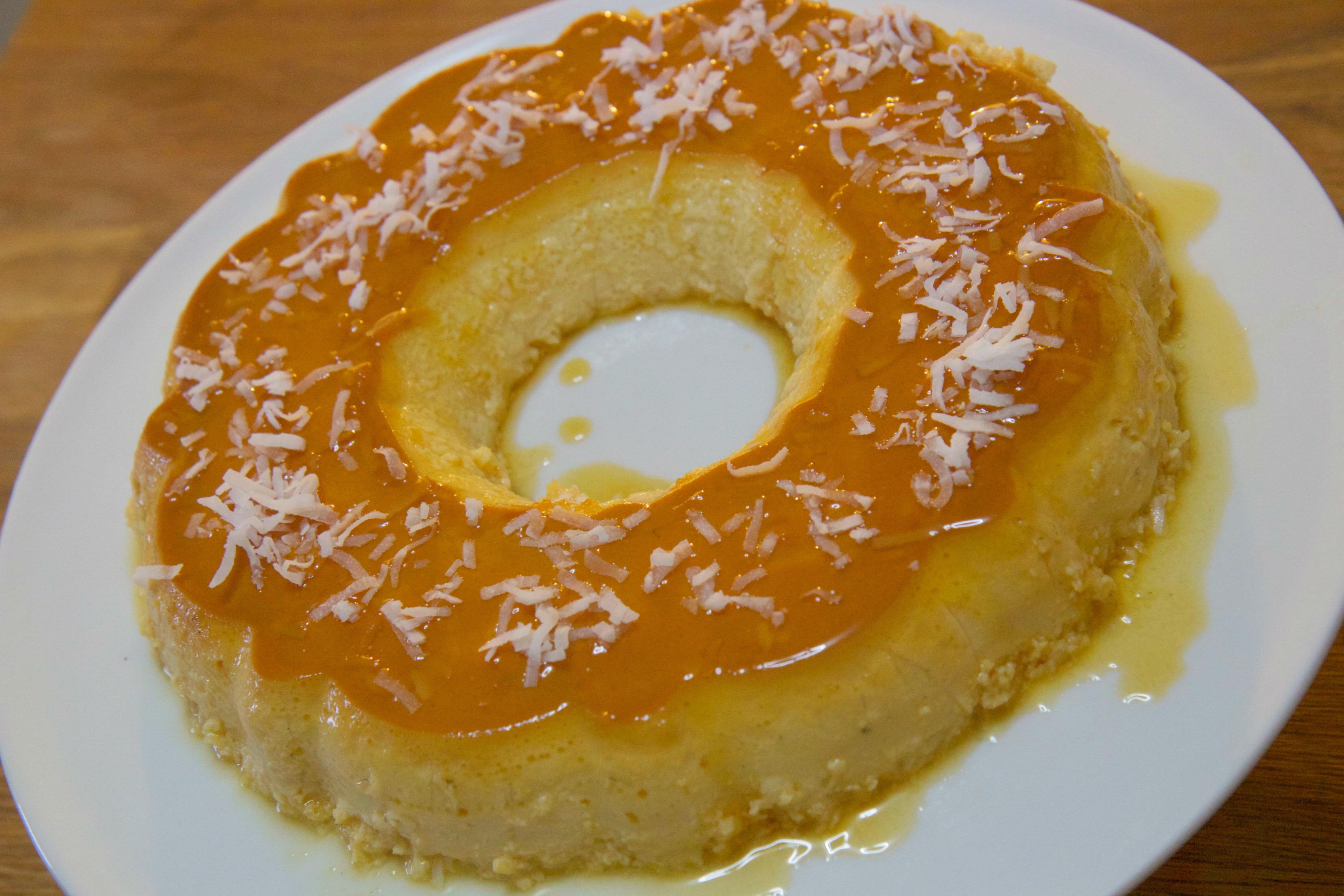 Coconut flan topped with shredded coconut 