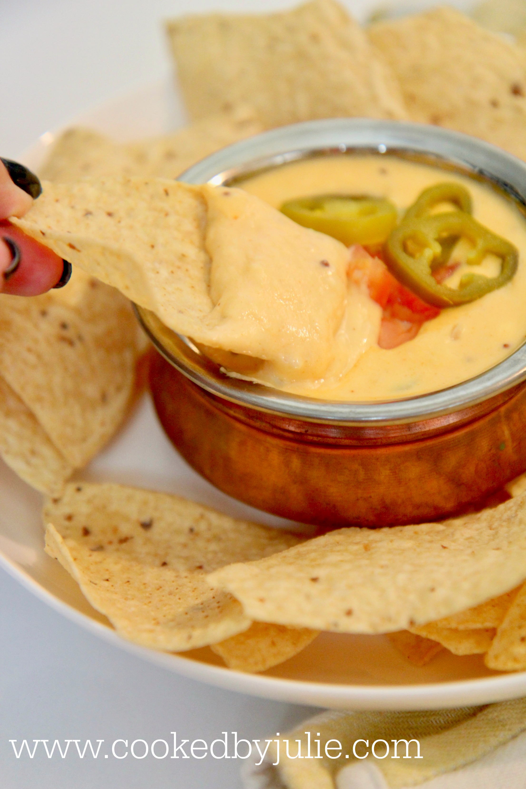 Crispy tortilla dipped in queso made with real cheddar cheese and cream cheese