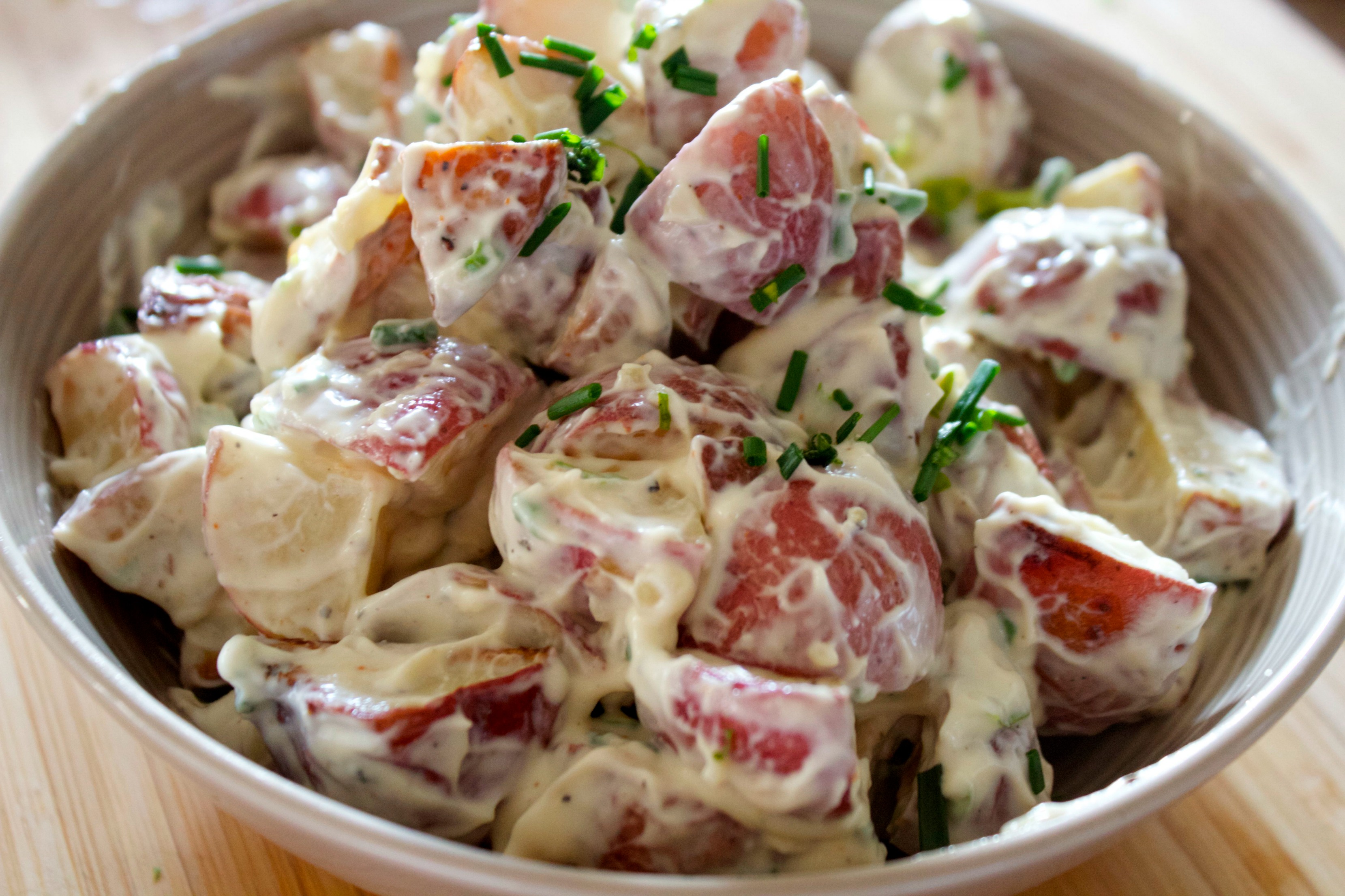 This creamy potato salad has roasted garlic and a tangy garlic mayo coating tender roasted potatoes. An amazing summer salad