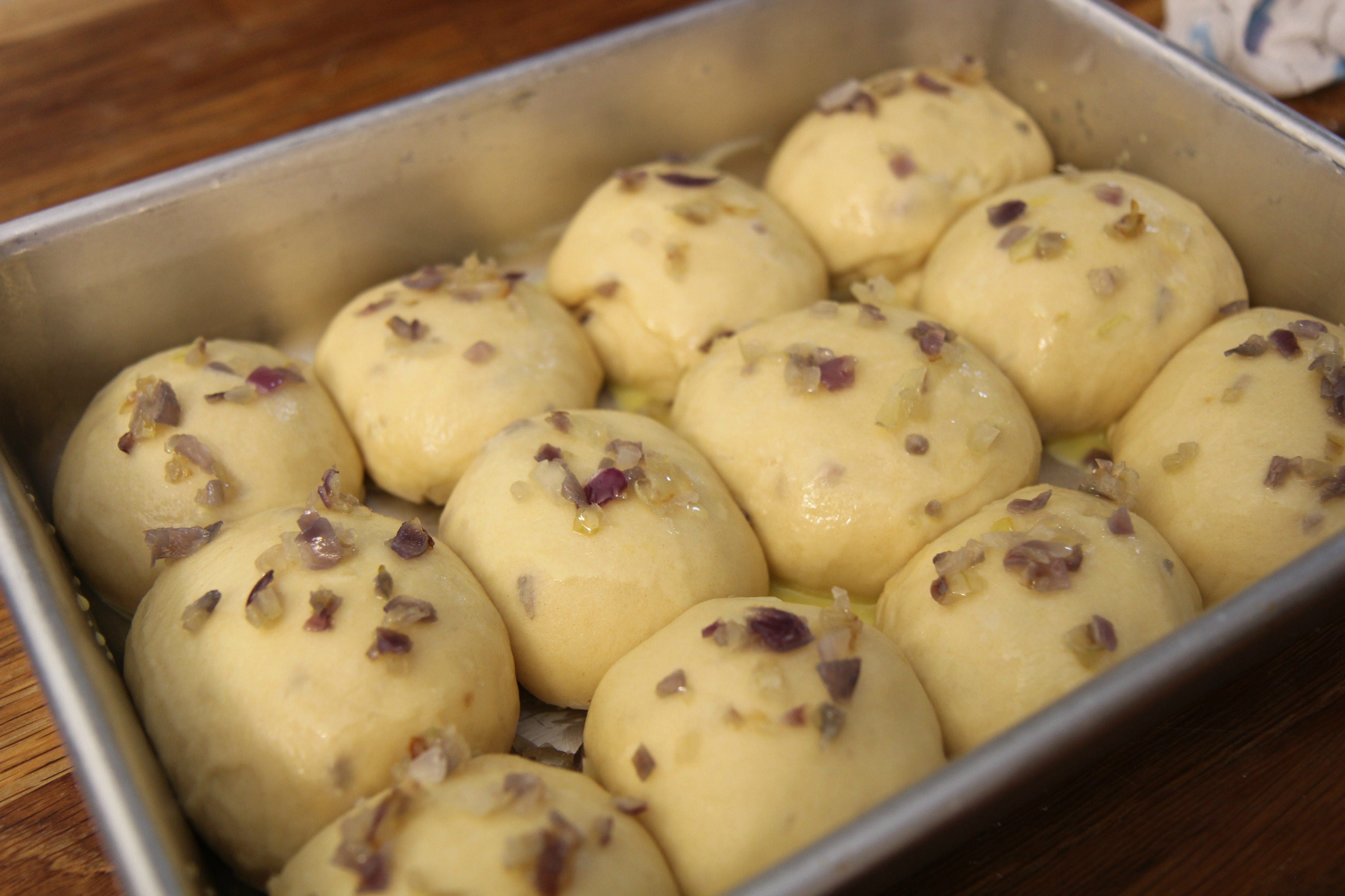 These onion dinner rolls are made with an easy base recipe for bread that's buttery and delicious.