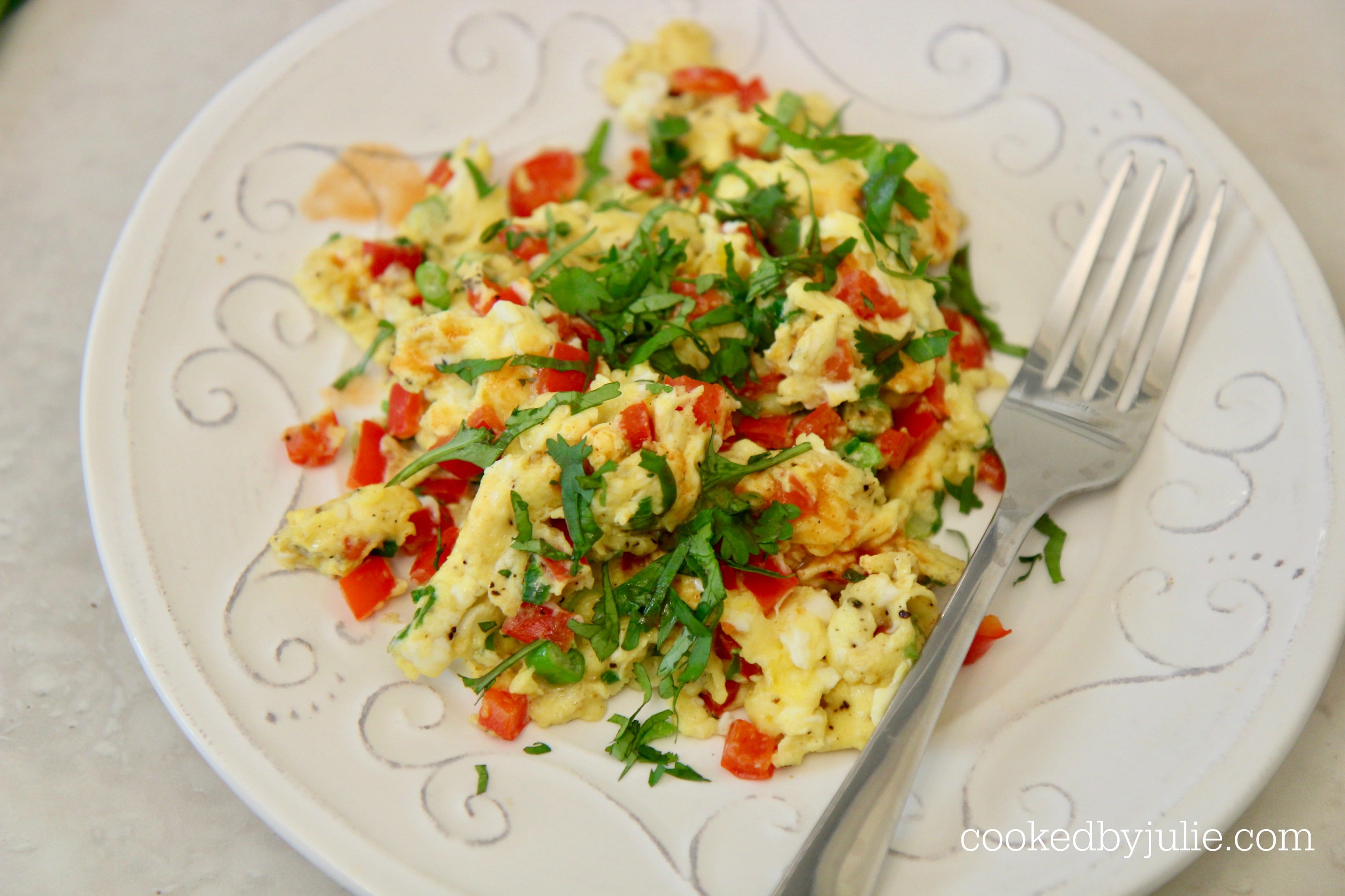 scrambled eggs with peppers and onions make the perfect easy breakfast.