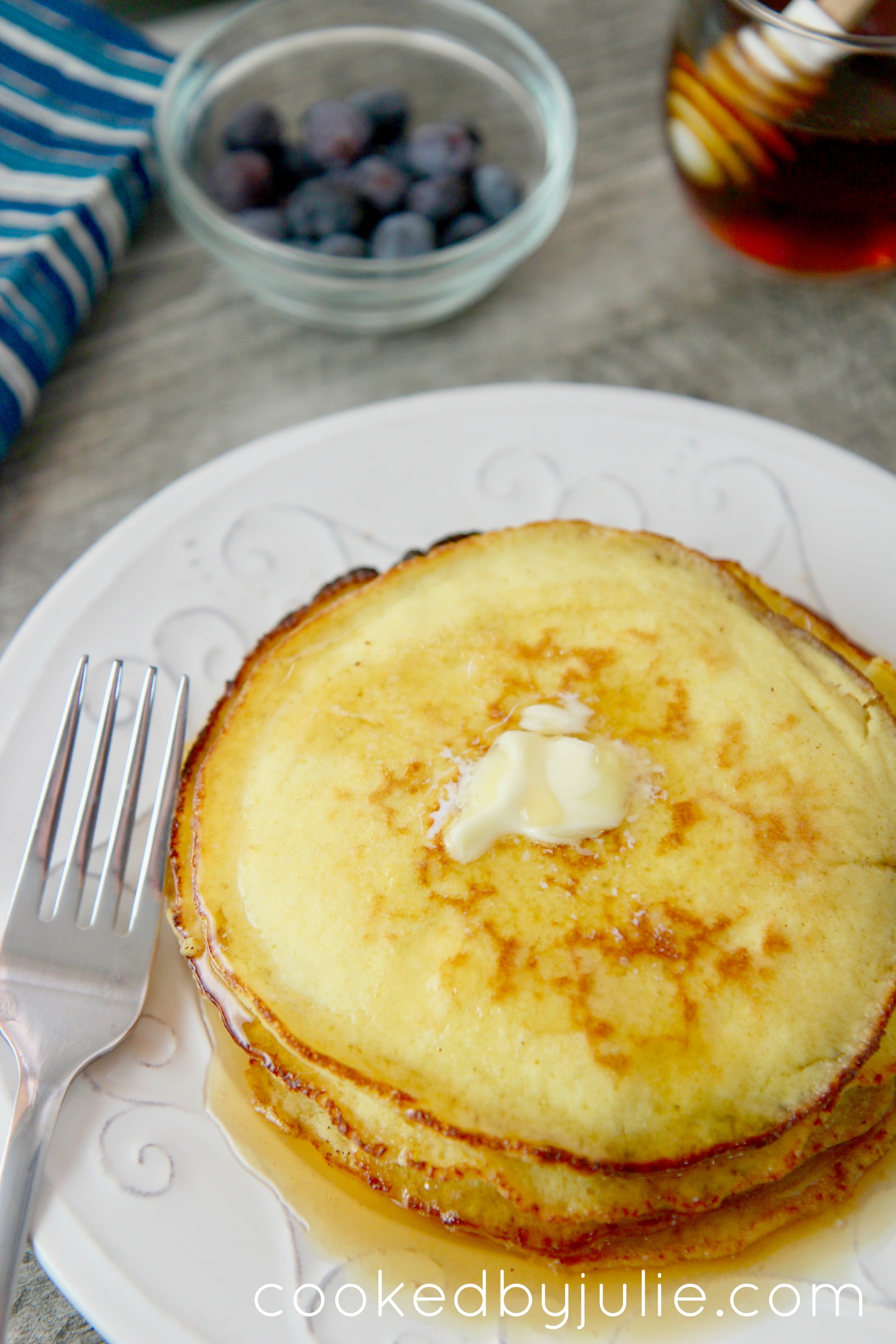 Keto-friendly low-carb pancakes with butter and syrup. Add blueberries for an extra garnish. 