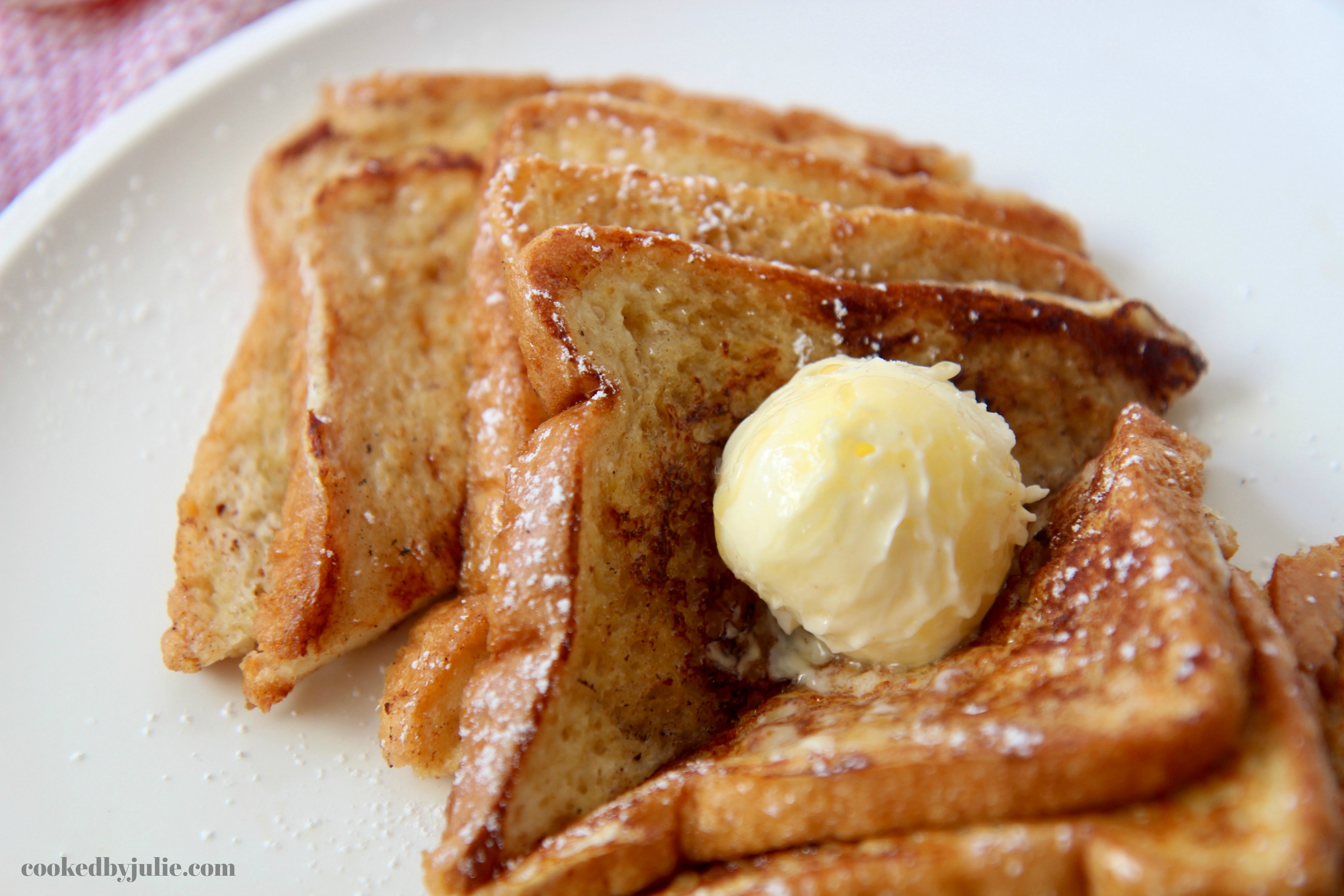 Perfectly cooked French Toast with softened butter 