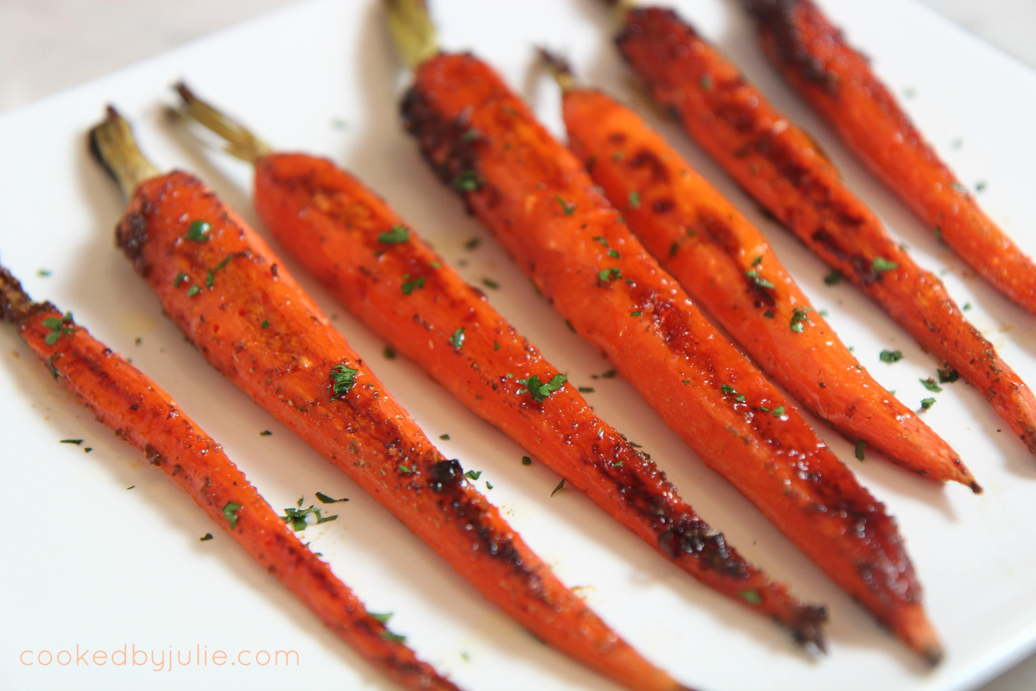 honey garlic carrots sprinkled with fresh parsley - a delicious and easy holiday side dish