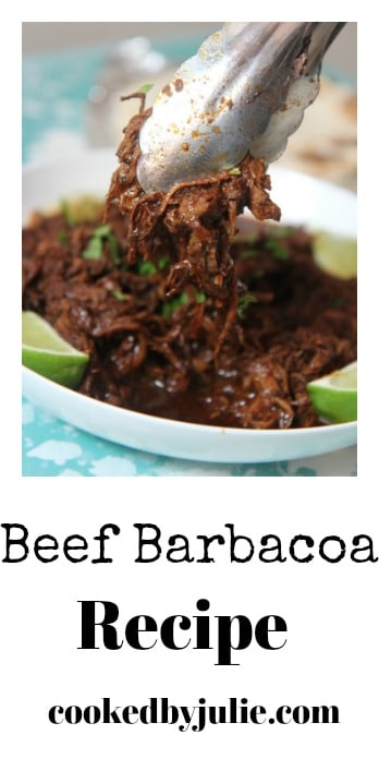 Barbacoa beef with lime wedges and cilantro 
