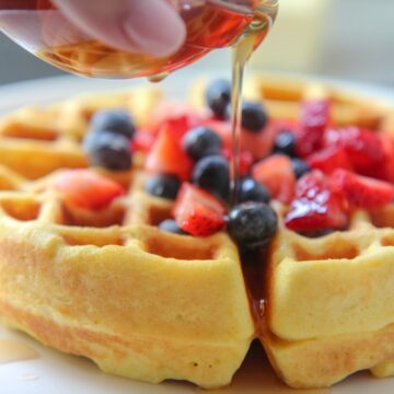 Keto waffles with syrup and fruit