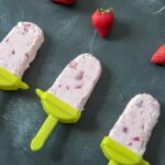 strawberry cheesecake popsicles with strawberry chunks