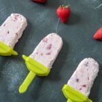 strawberry cheesecake popsicles with strawberry chunks