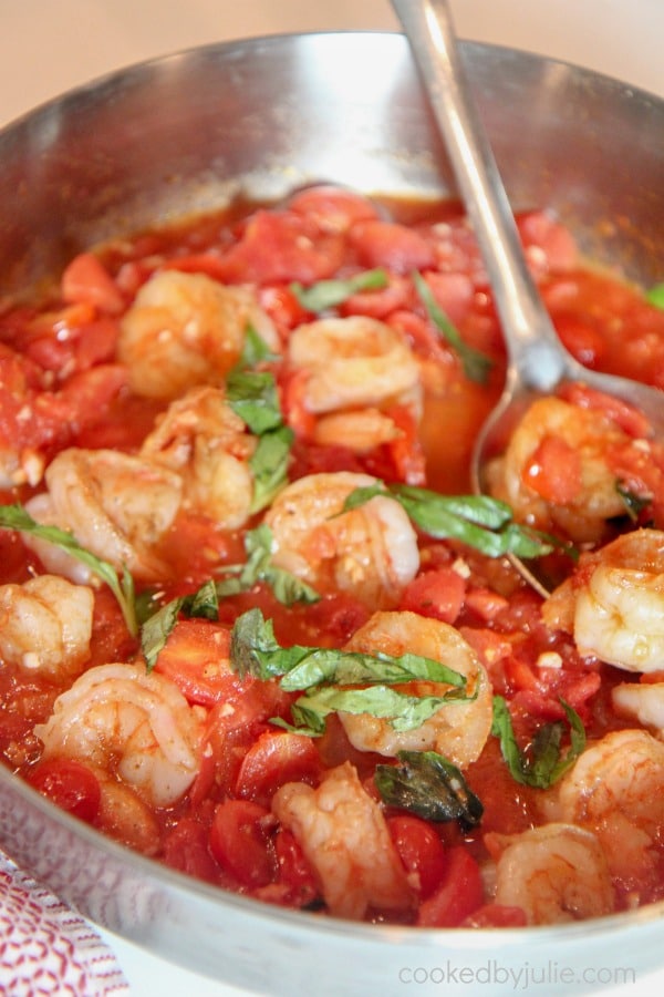 a pot of tomato and basil shrimp