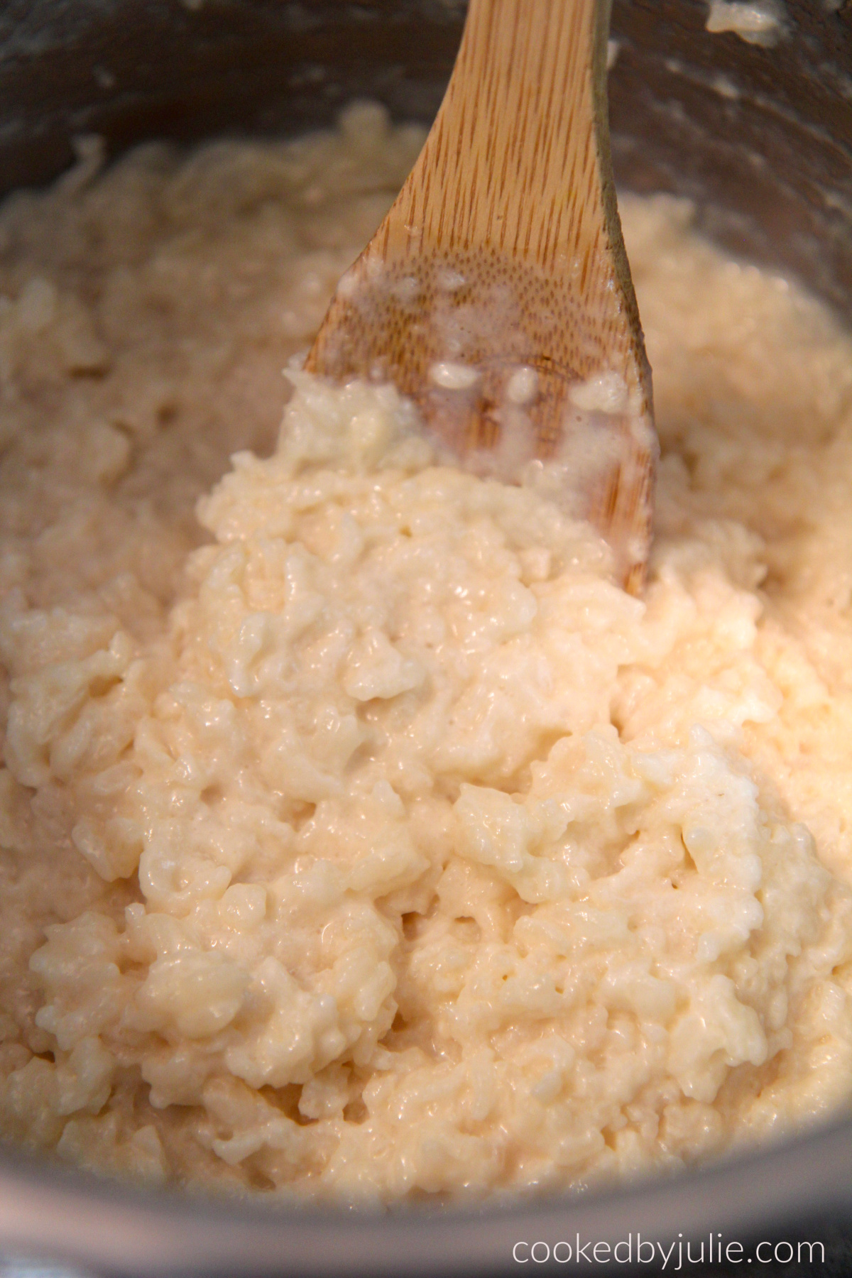 instant pot rice pudding and a wooden spoon.