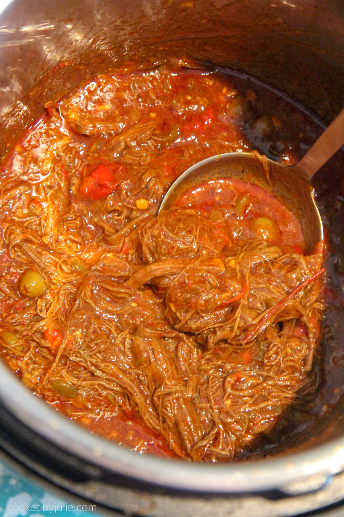 shredded flank steak in a tomato broth 