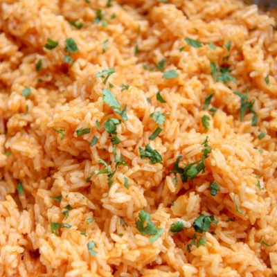 a large serving of Spanish rice and fresh cilantro