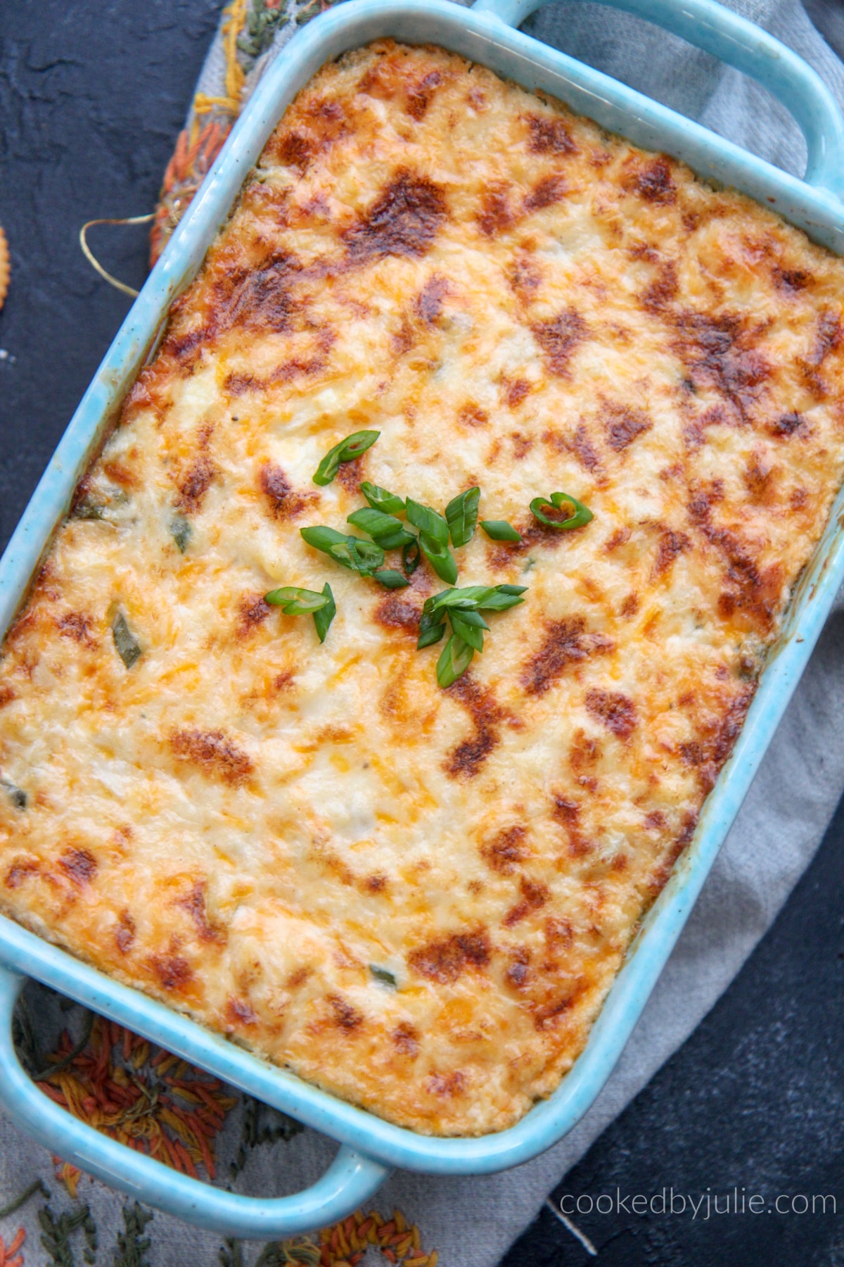 Hot crab dip in a blue baking dish