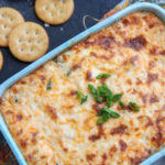 crab dip with green onions and ritz crackers.