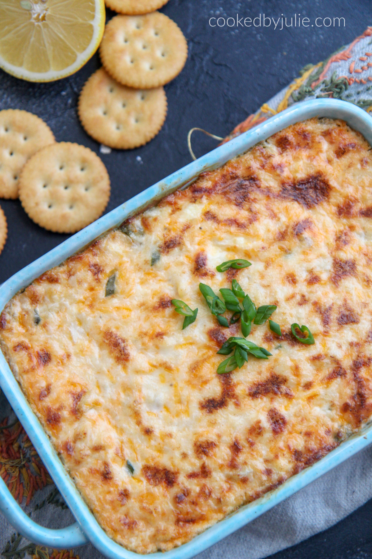 crab dip with green onions and ritz crackers.