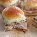 ham and cheese sliders on a wooden board